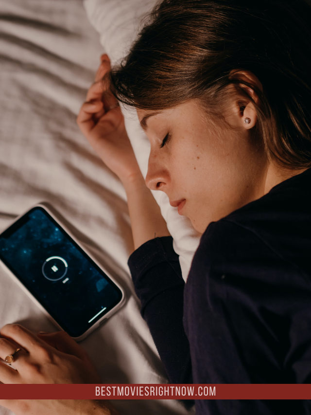 a girl sleeping with a phone beside her