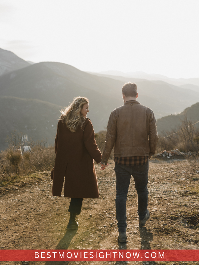 Couple Walking Holding Hands in Mountain Landscape 