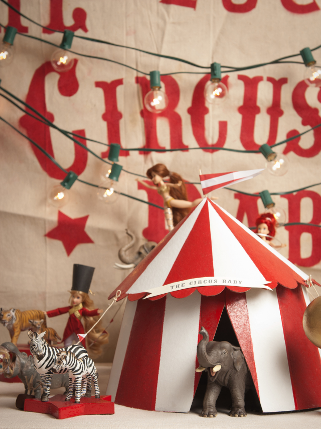 a picture of a circus display with animals and acrobats